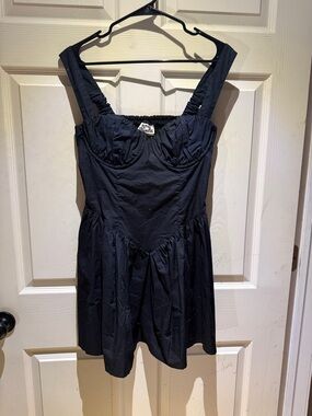 Fitted Black Sleeveless Mini Dress with Structured Bust